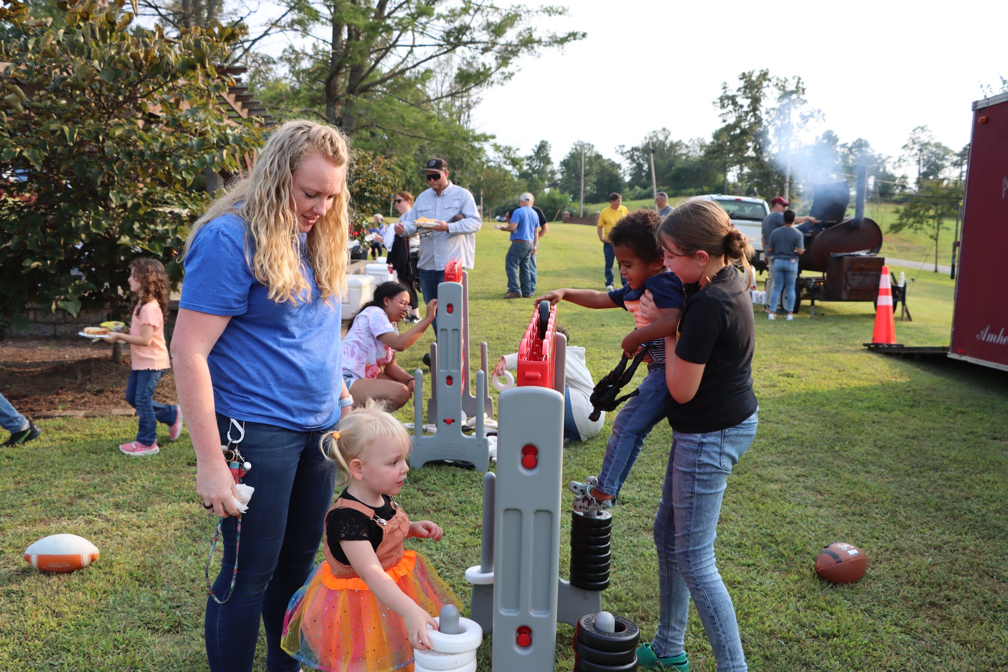 Families at an activity station at the Amherst County Community Tailgate
