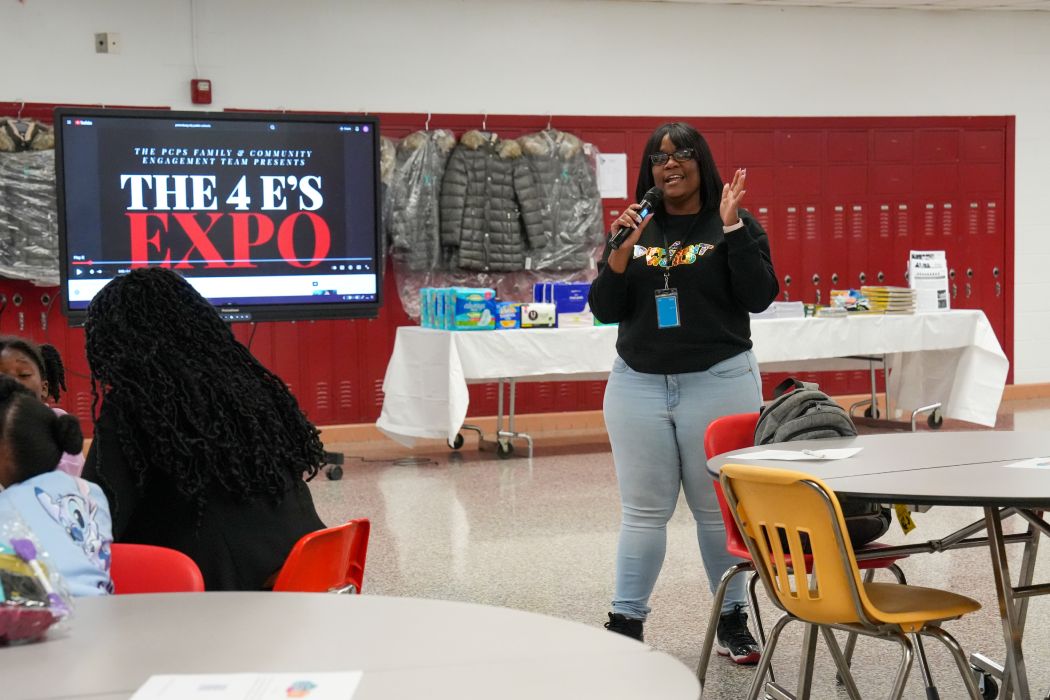 Presenter on stage at the 4 E's Expo at Petersburg High School