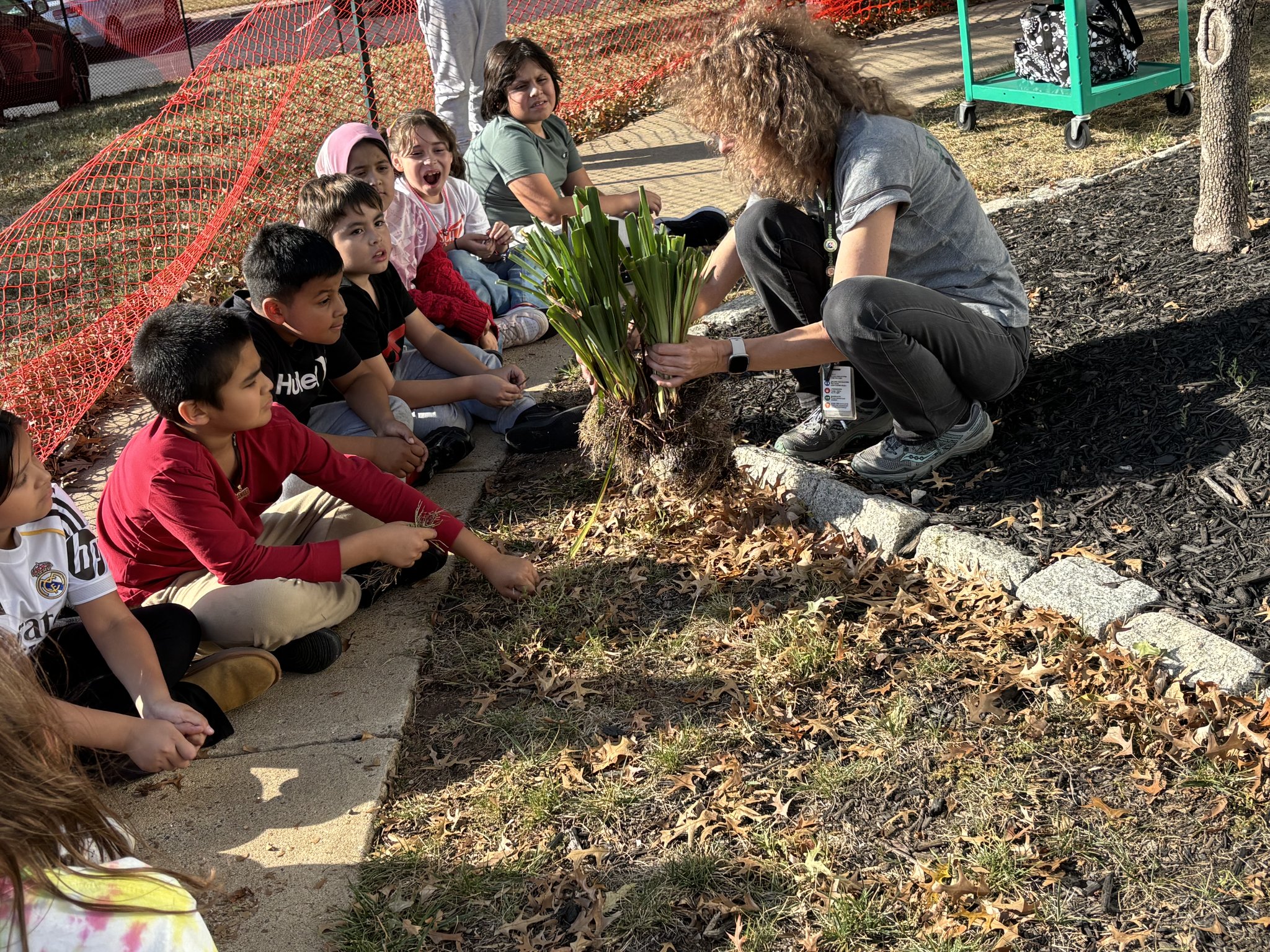 Guilford Elementary students planting in the school garden as part of the Green Beans Club