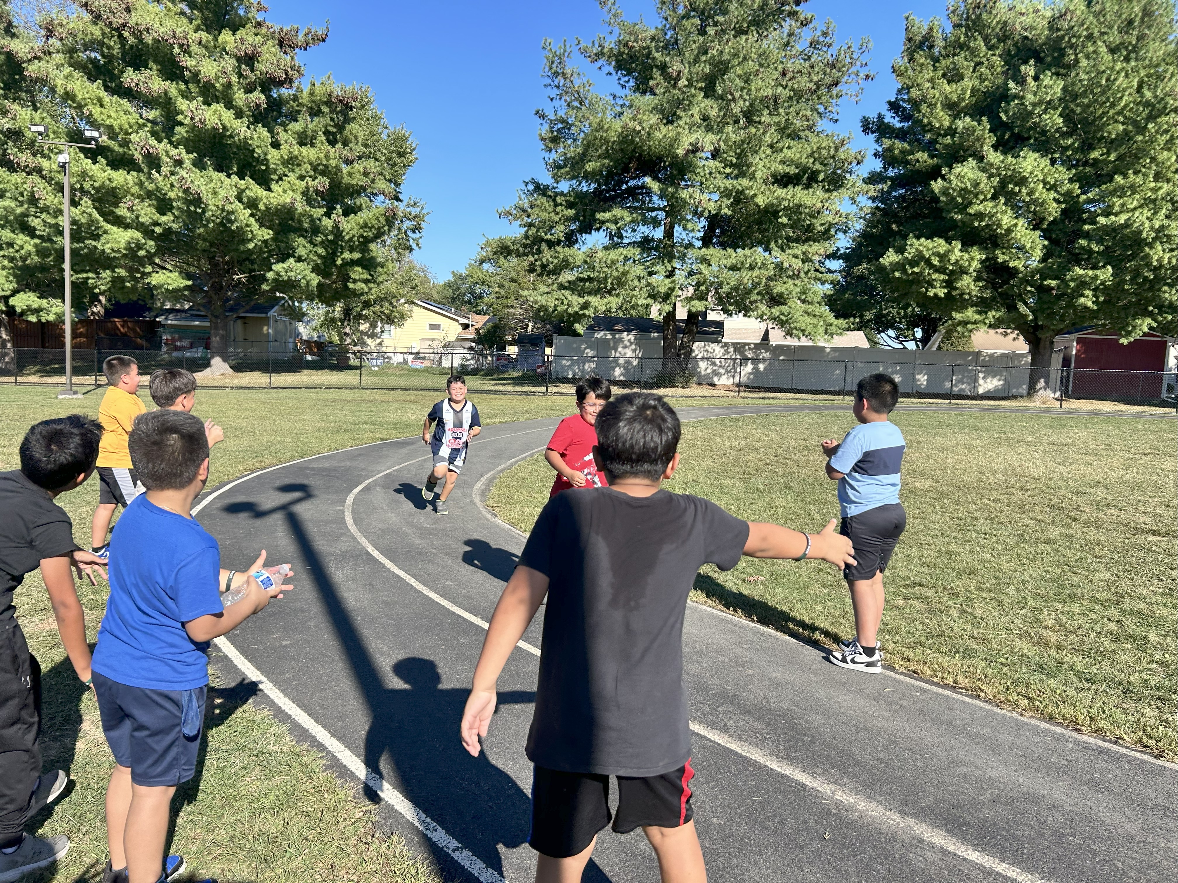 Students running on a school track