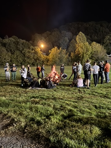 J.I. Burton High School students at a nighttime bonfire community event