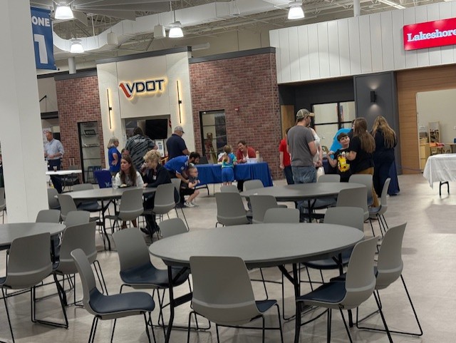 VDOT representatives speaking with families at a school event