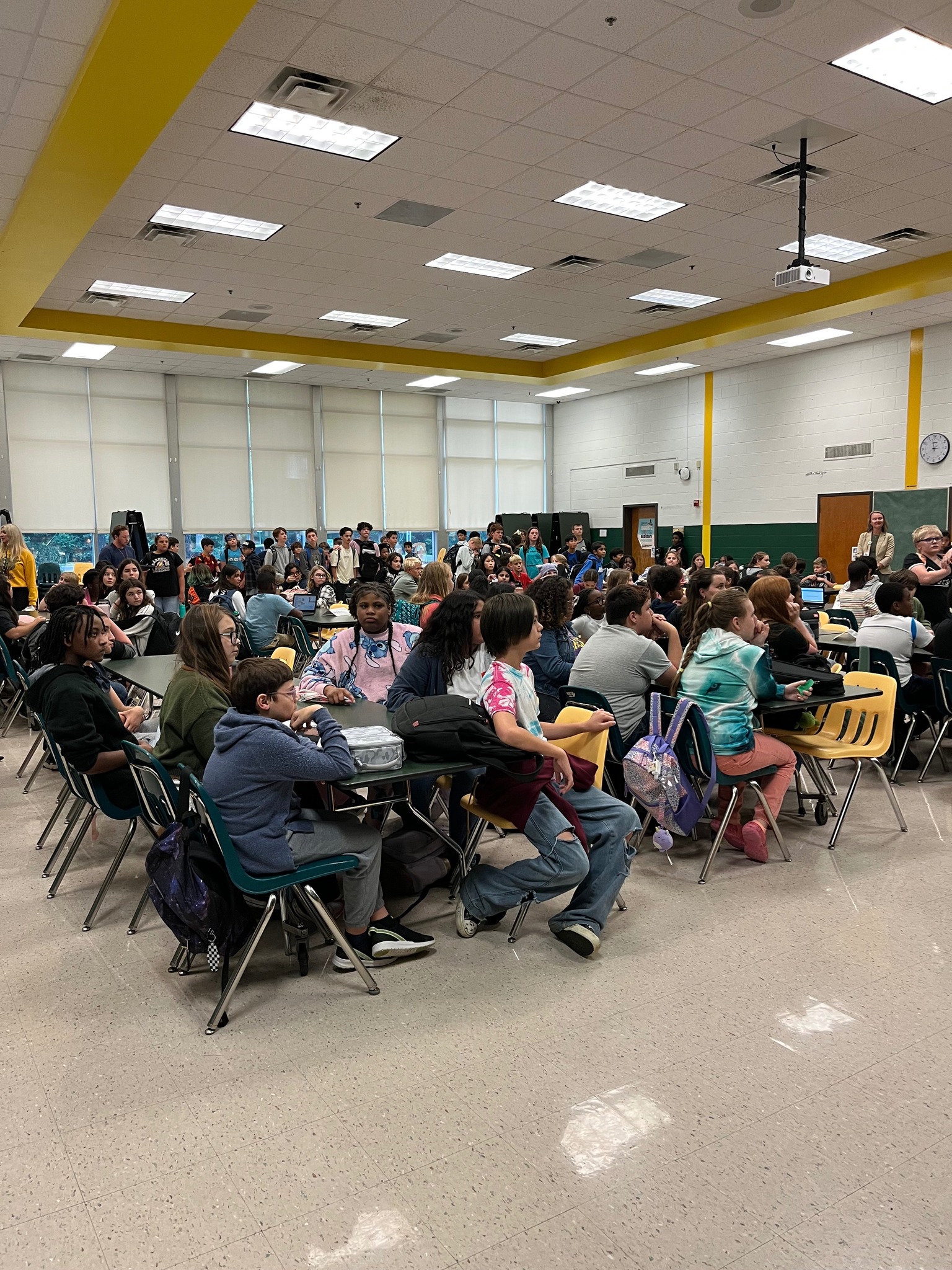 Students filling the Queens Lake Middle School cafeteria for the first clubs meeting