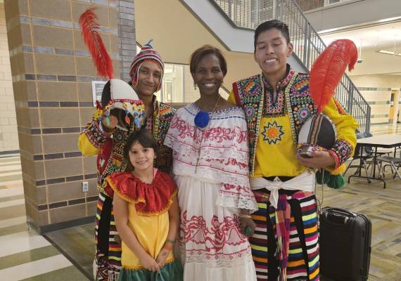 Performers participating in a Latin cultural event