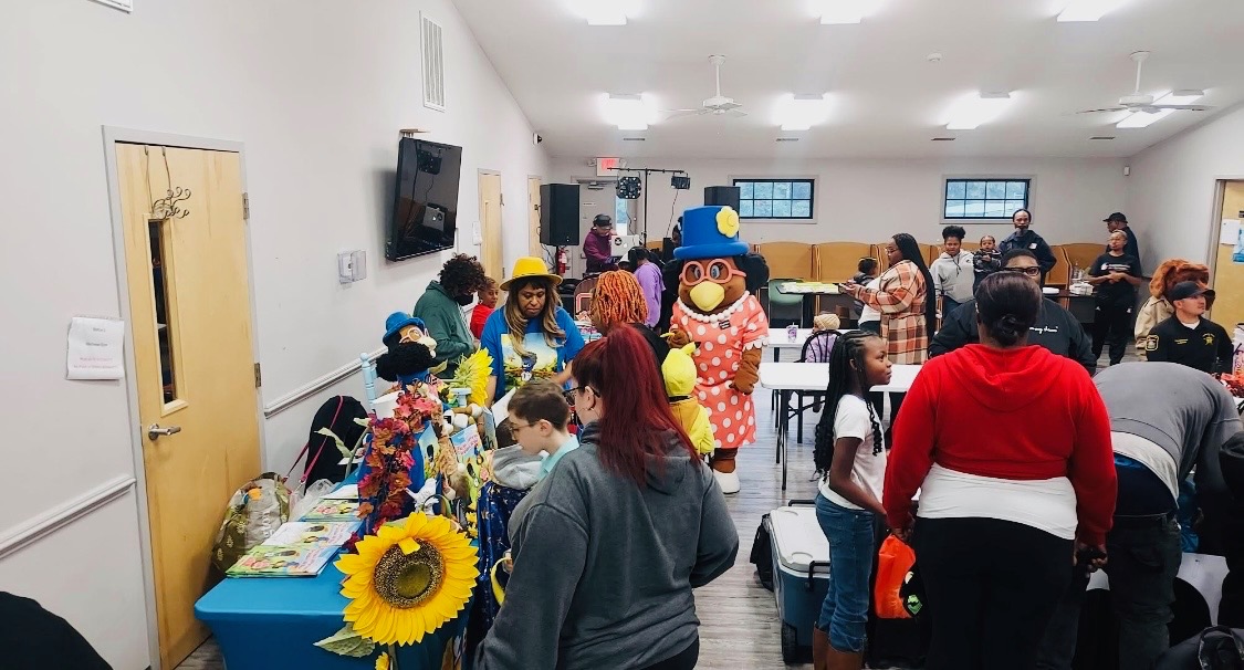 Families and school mascots at a Greensville County Community Schools event