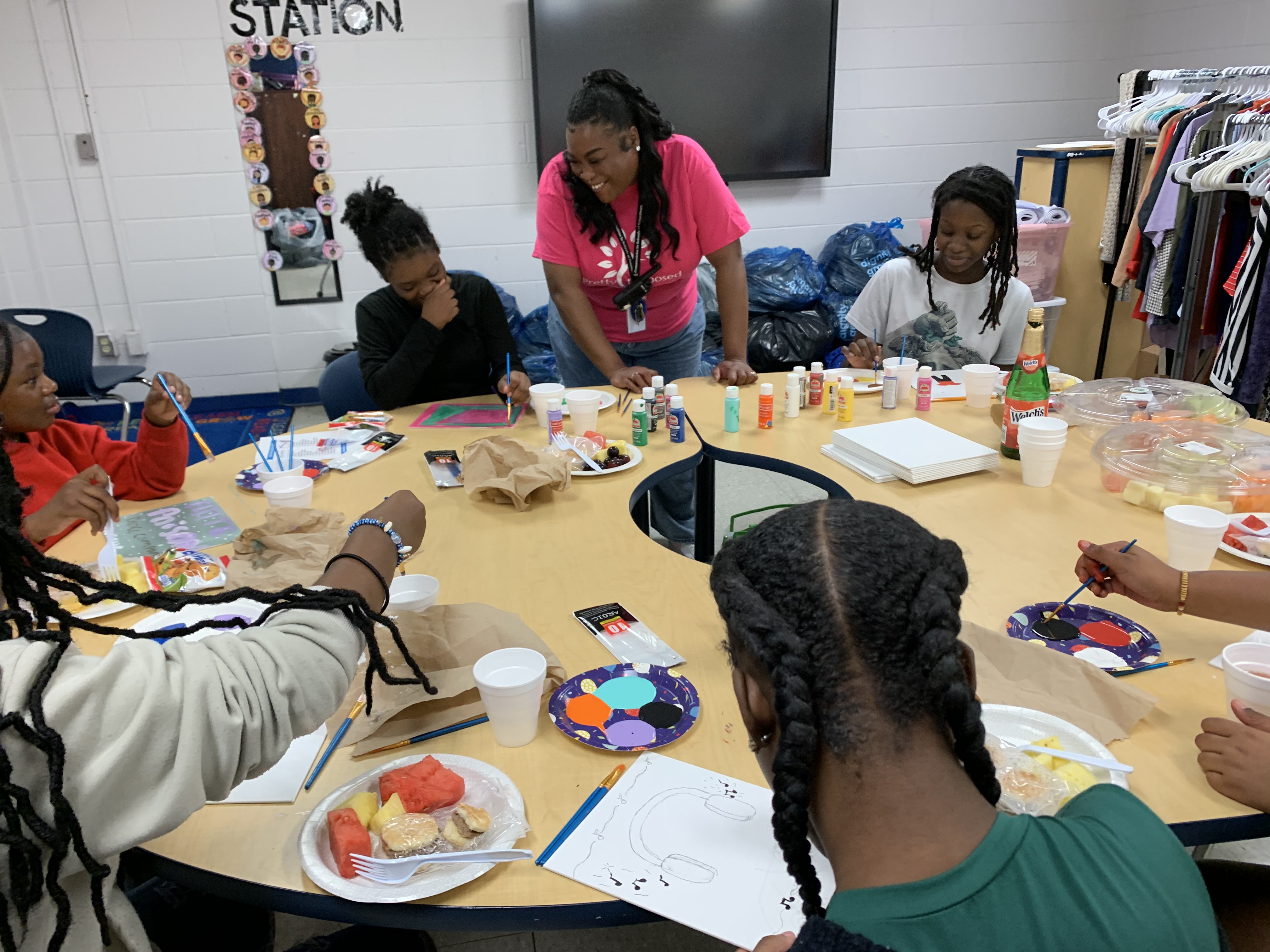 Petersburg students doing an art activity at a table, CIS Tri-Cities