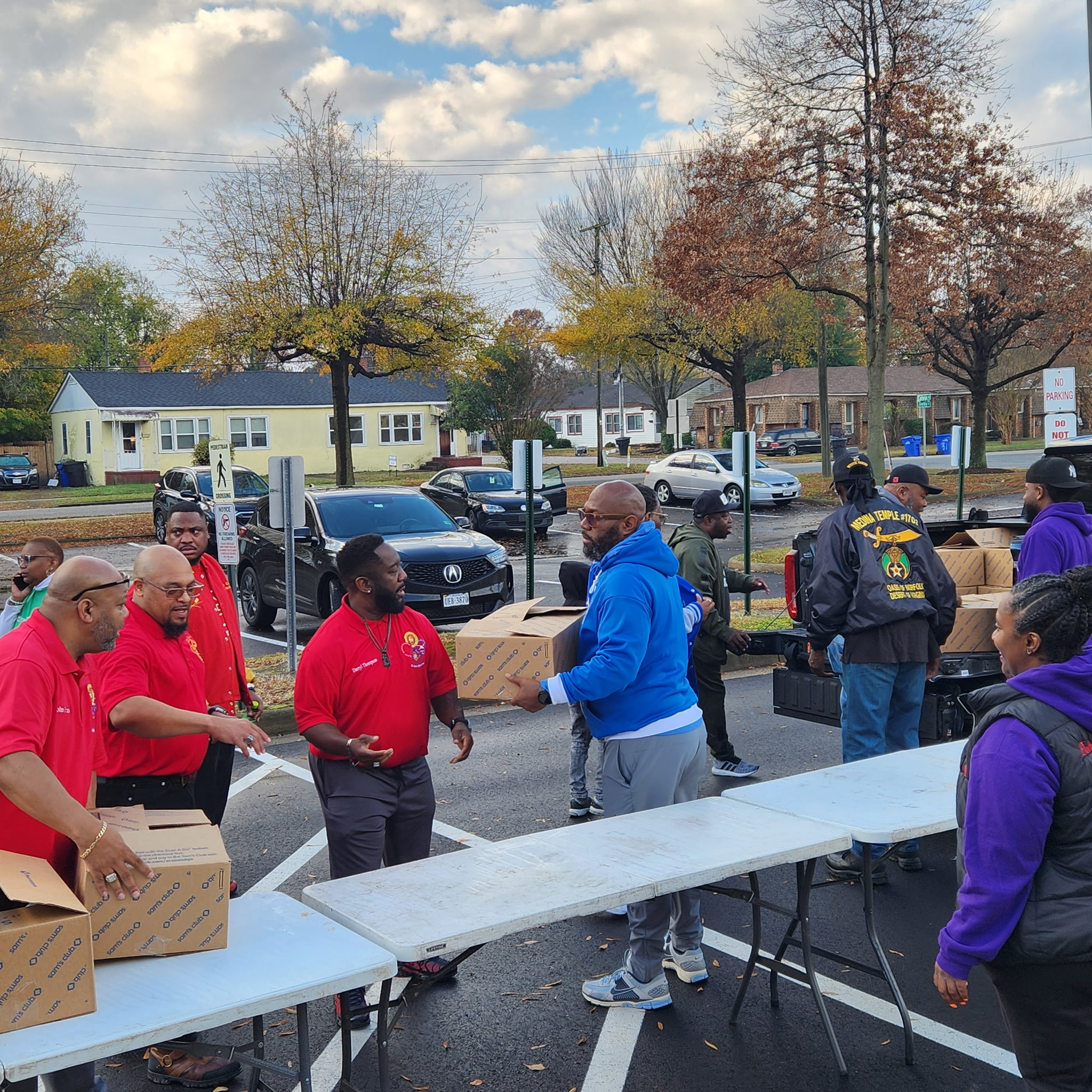 Staff and volunteers distributing Thanksgiving meal boxes at Douglas Park Elementary